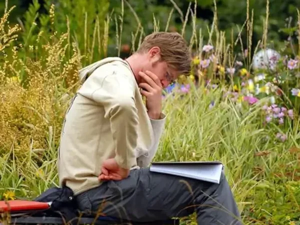 A-man-reading-and-contemplating-a-text (1) A man reading and contemplating Dharma teachings