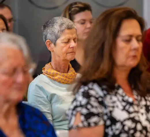 People meditating at Tushita KMC